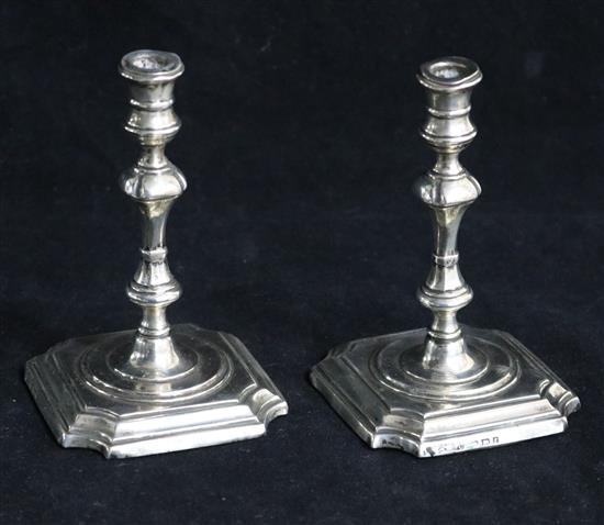 A pair of Edwardian silver tapersticks by George Unite, Birmingham, 1905, 10.5cm.